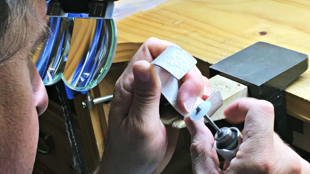 Polishing a handcrafted silver cuff bracelet